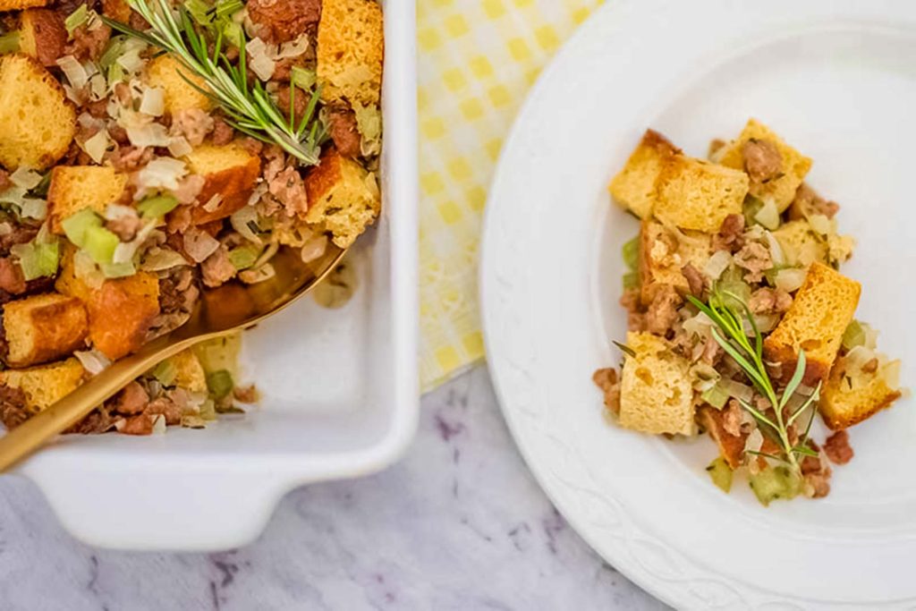 Keto sausage and herb stuffing being served on a plate.