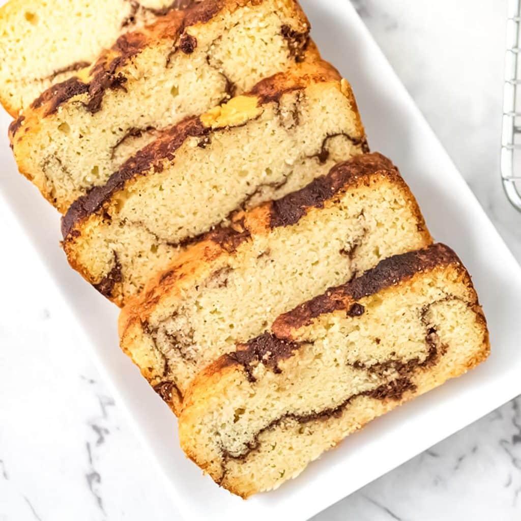 Slices of keto cinnamon bread on a white serving plate