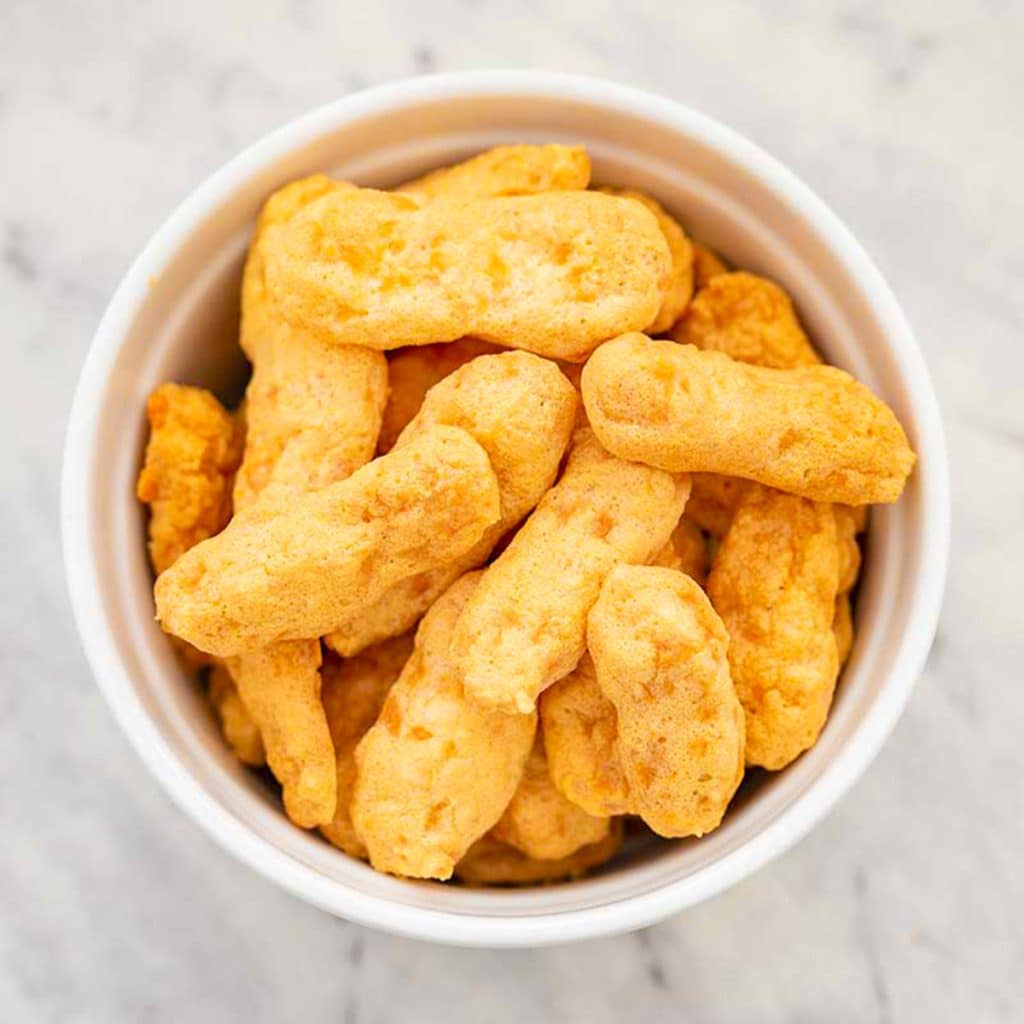 Keto cheetos in a white bowl.