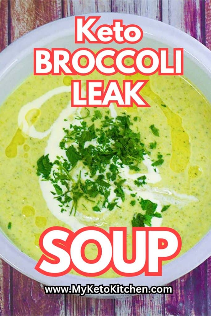 Keto broccoli and leak soup in a white bowl garnished with parsley.