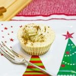 Keto eggnog cheesecakes on a Christmas themed plate.