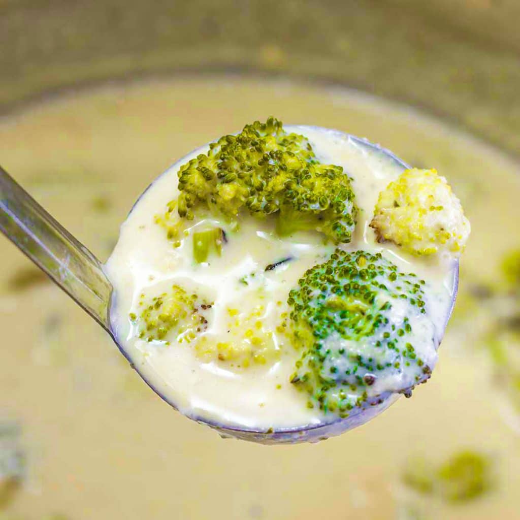 A ladle full of keto broccoli and cheese soup.