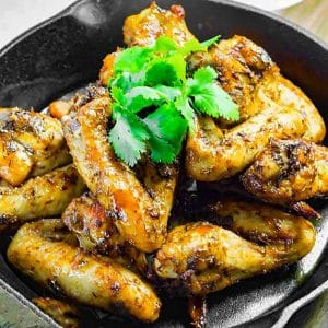 Texan BBQ chicken wings in a black serving dish.