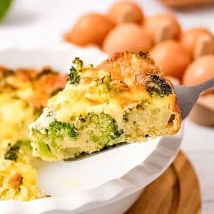 A slice of keto broccoli and cheese quiche.