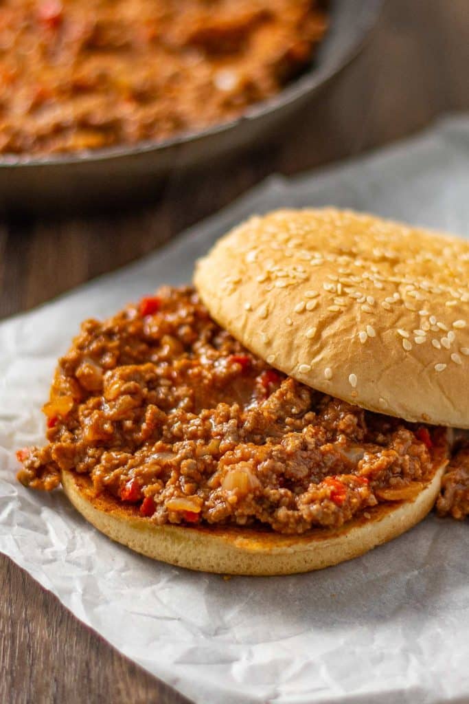 Keto Sloppy Joe in a burger bun on baking paper.