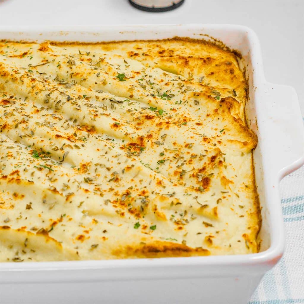 Keto cottage pie finished in a white baking dish.