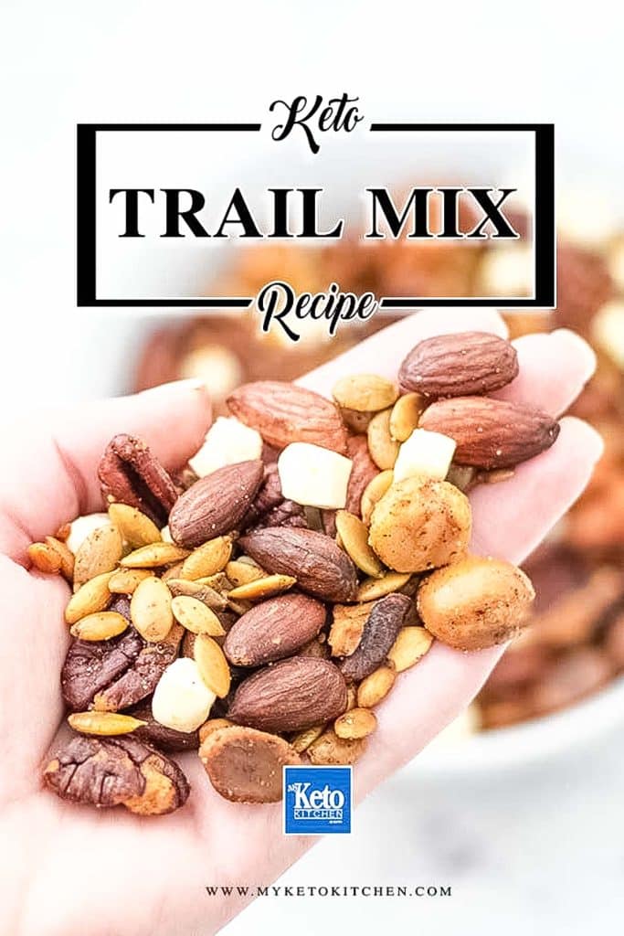 A handful of keto trail mix in a persons hand.