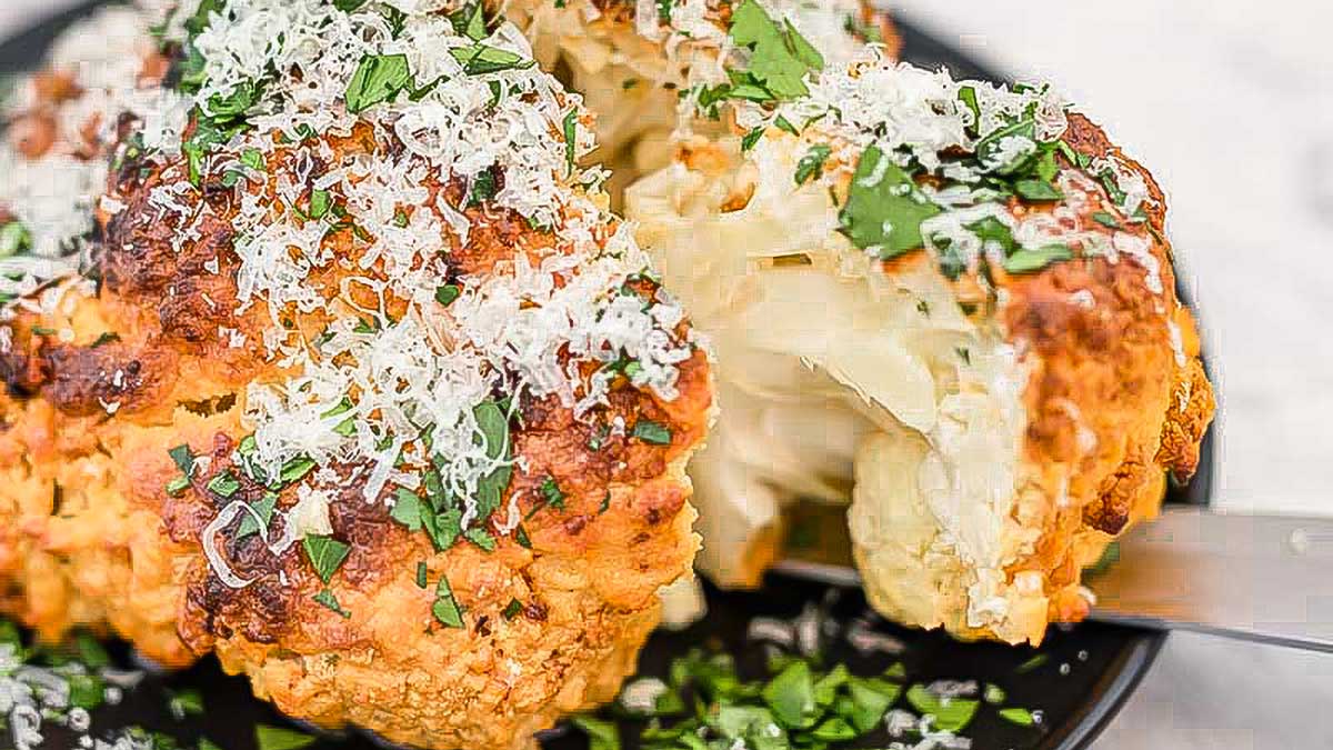 Whole Roasted Cauliflower Baked with Garlic and Cheese