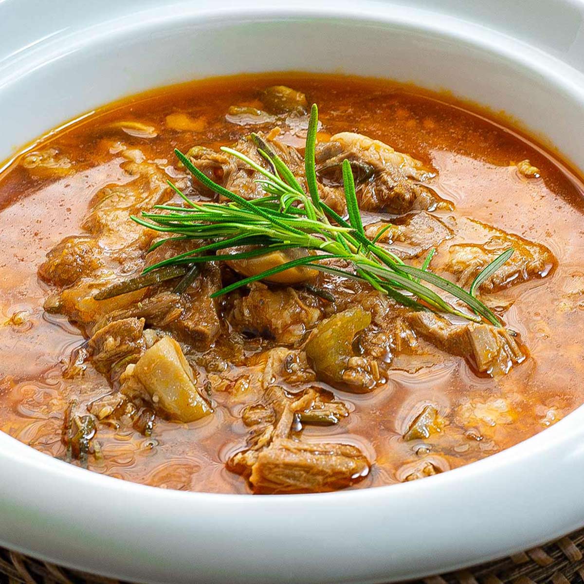 Keto lamb stew in a white soup bowl.